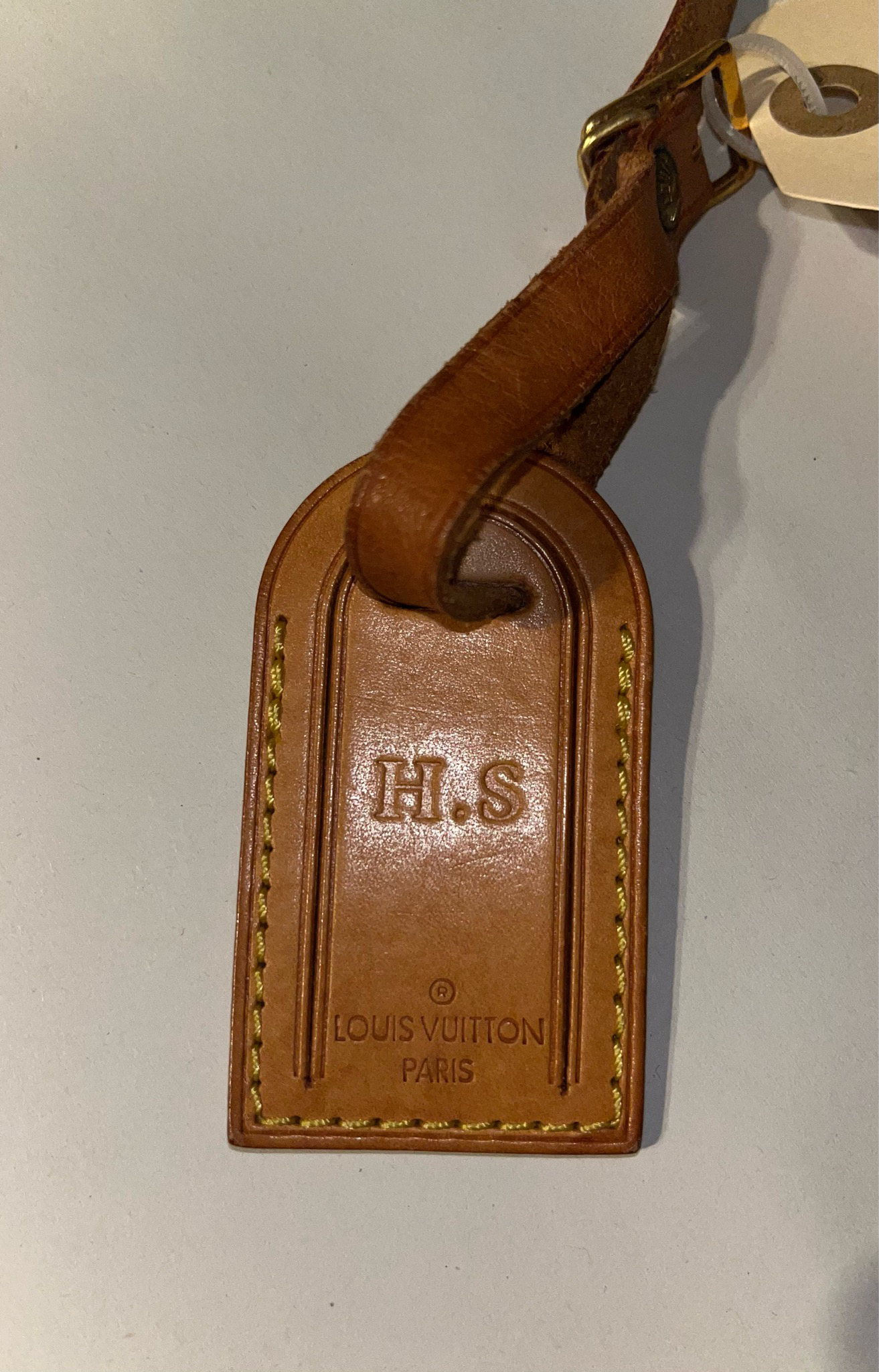 Louis Vuitton brown luggage tag