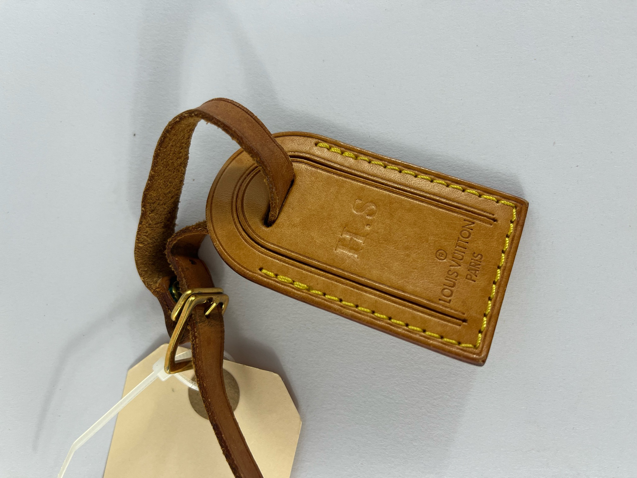 Louis Vuitton brown luggage tag