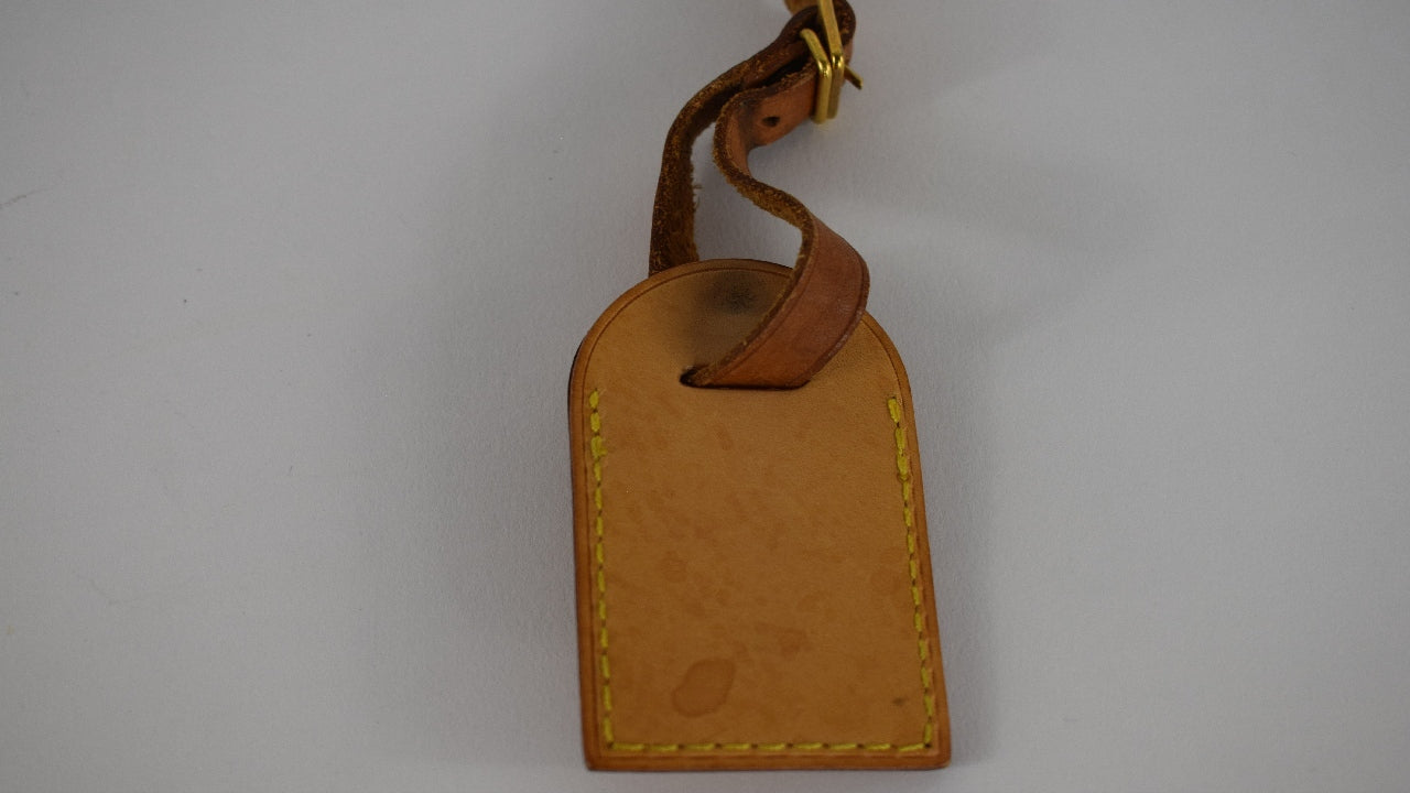 Louis Vuitton brown luggage tag